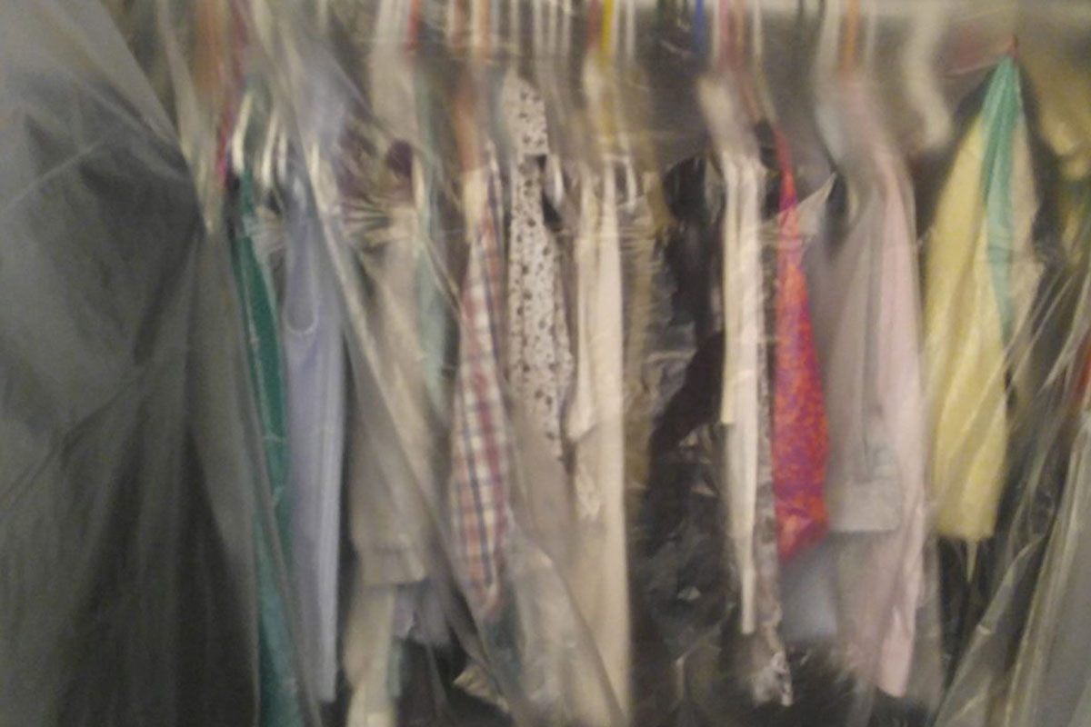 Plastic over clothing in a closet