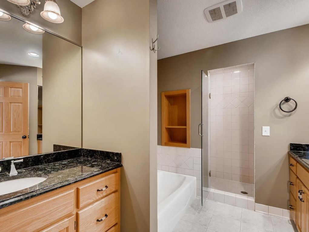 Bathroom with dark walls and countertops